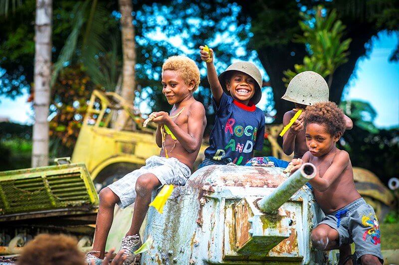 Time Traveling Adventures In Papua New Guinea To Add To Your 2024 Bucket List Local Children At The Kokopo War Museum, East New Britain Province, Papua New Guinea