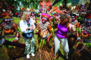 Goroka Show dancers with Tourists