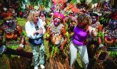Goroka Show dancers with Tourists