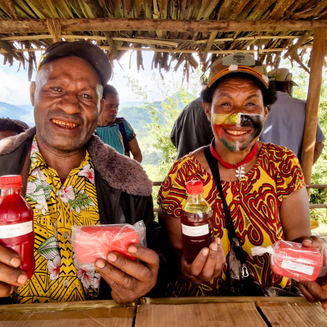 John And His Wife, Lorin Kisan, Proudly Showing Off Their Marita Oil And Soup Products During The Marita Festival In Jimi