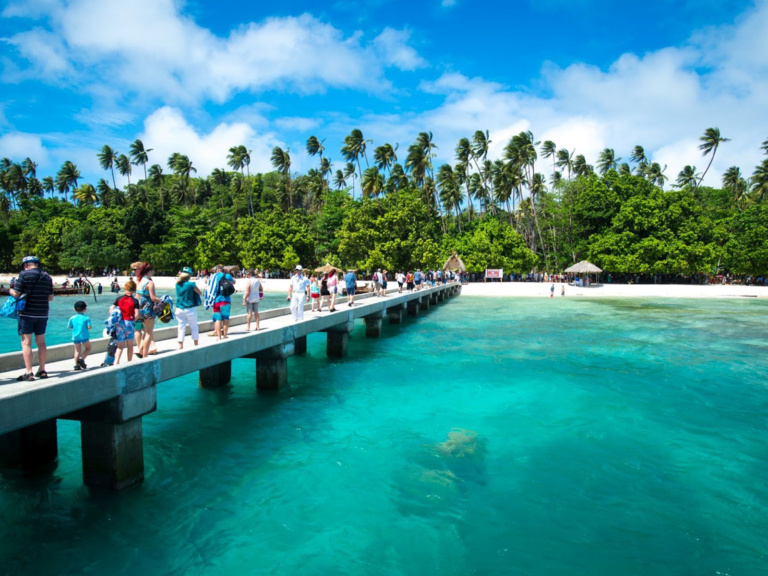 Tourists At The Kiriwina Jetty, Trobriand Islands