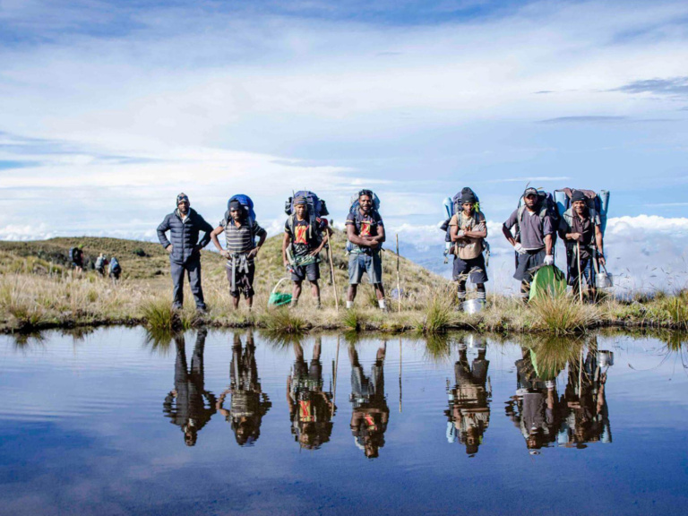 Tour Guides Near A Glacial Lake, Mount Giluwe, Highlands Region.