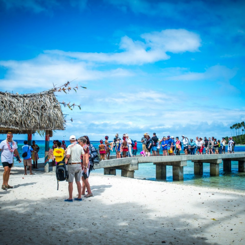 Guests arriving on Kiriwina, Trobriand Islands Guests Arriving On Kiriwina, Trobriand Islands